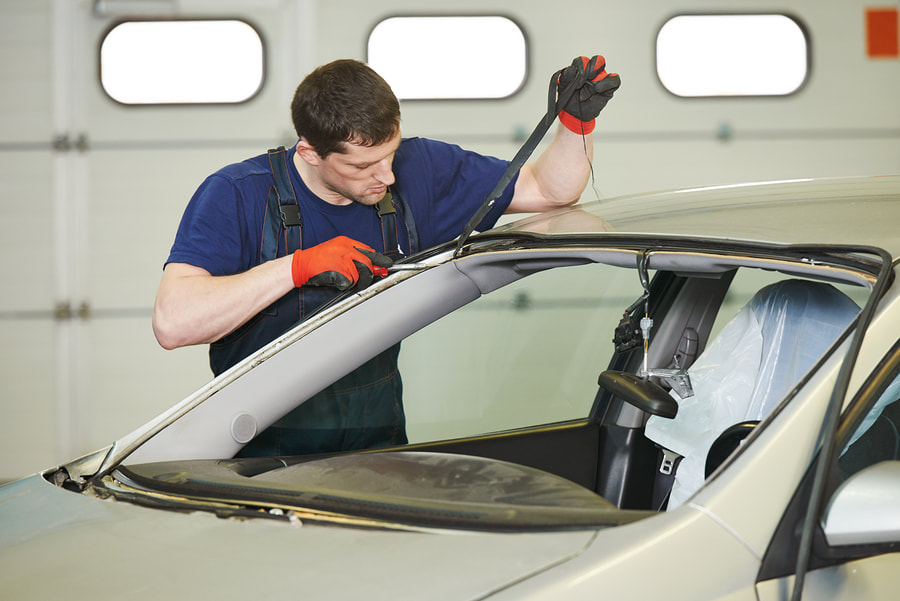 worker repairing the windshield